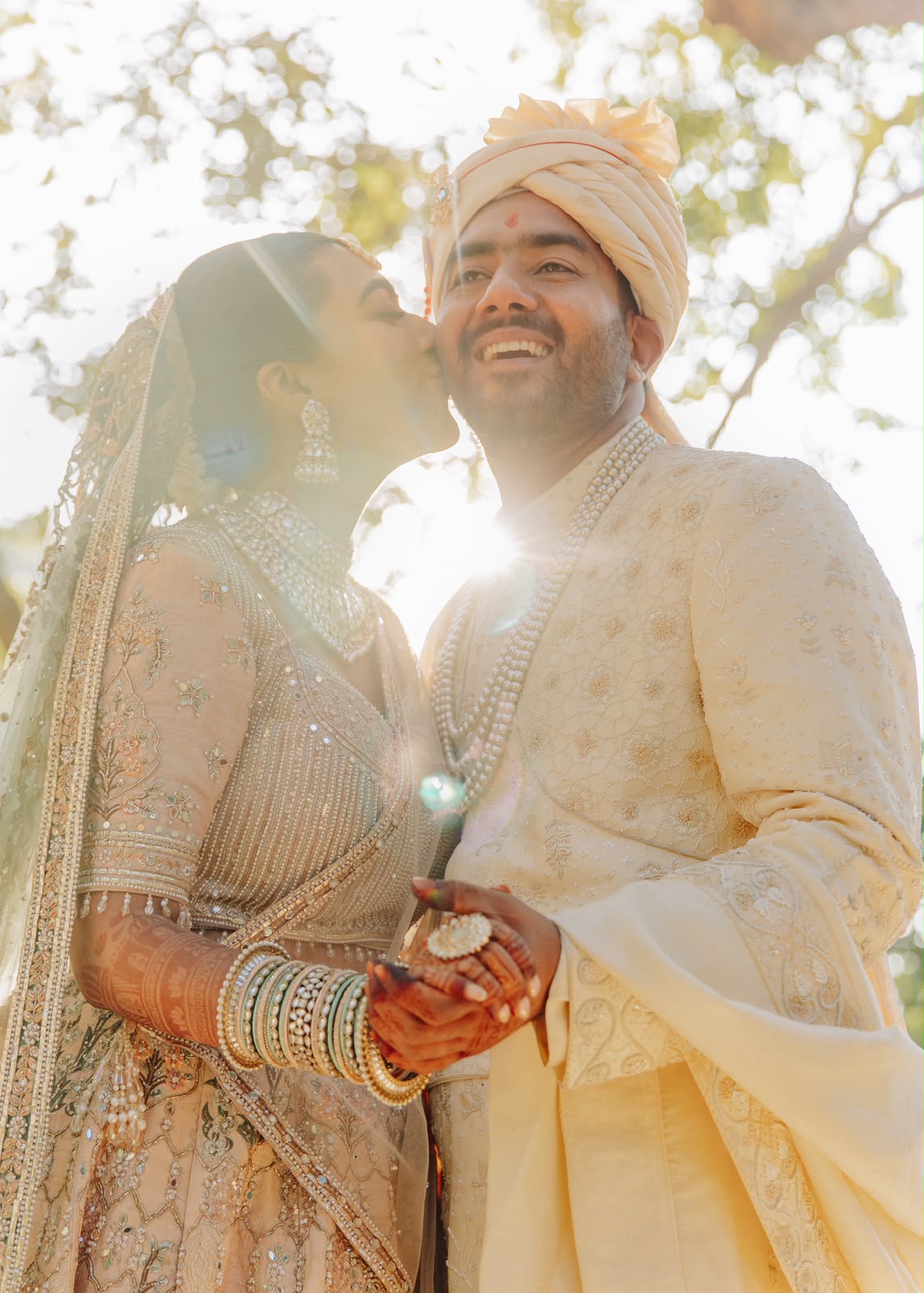 Ankshita kissing Rohit on the cheek in the sunlight