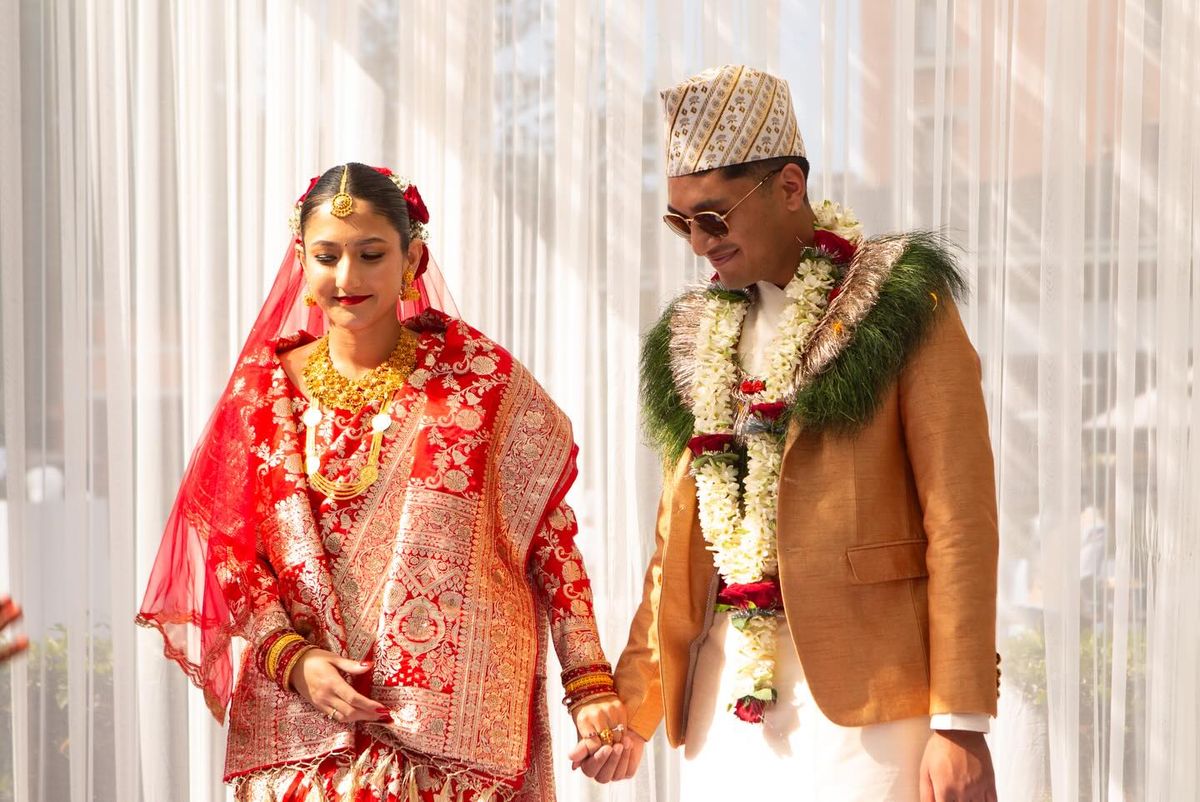 Anushka and Prabir hand in hand at the wedding