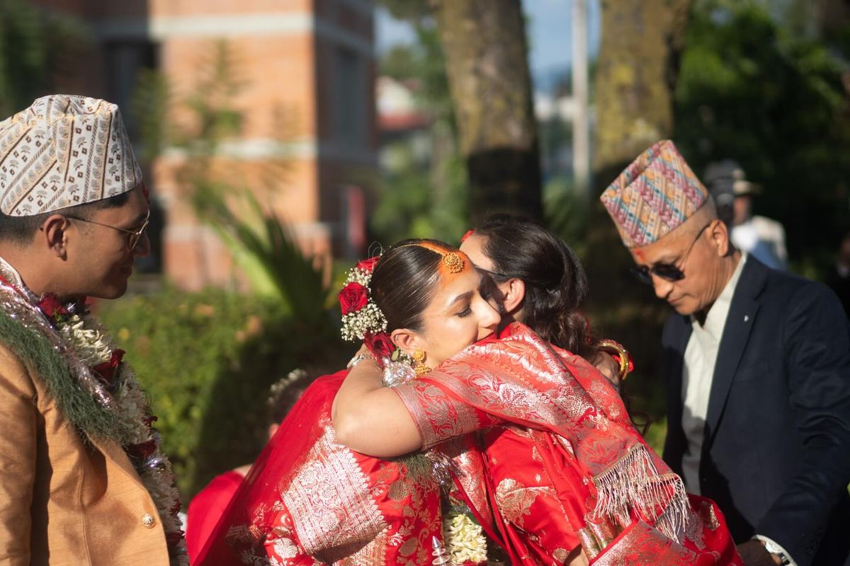 Anushka embracing a loved one on her wedding day