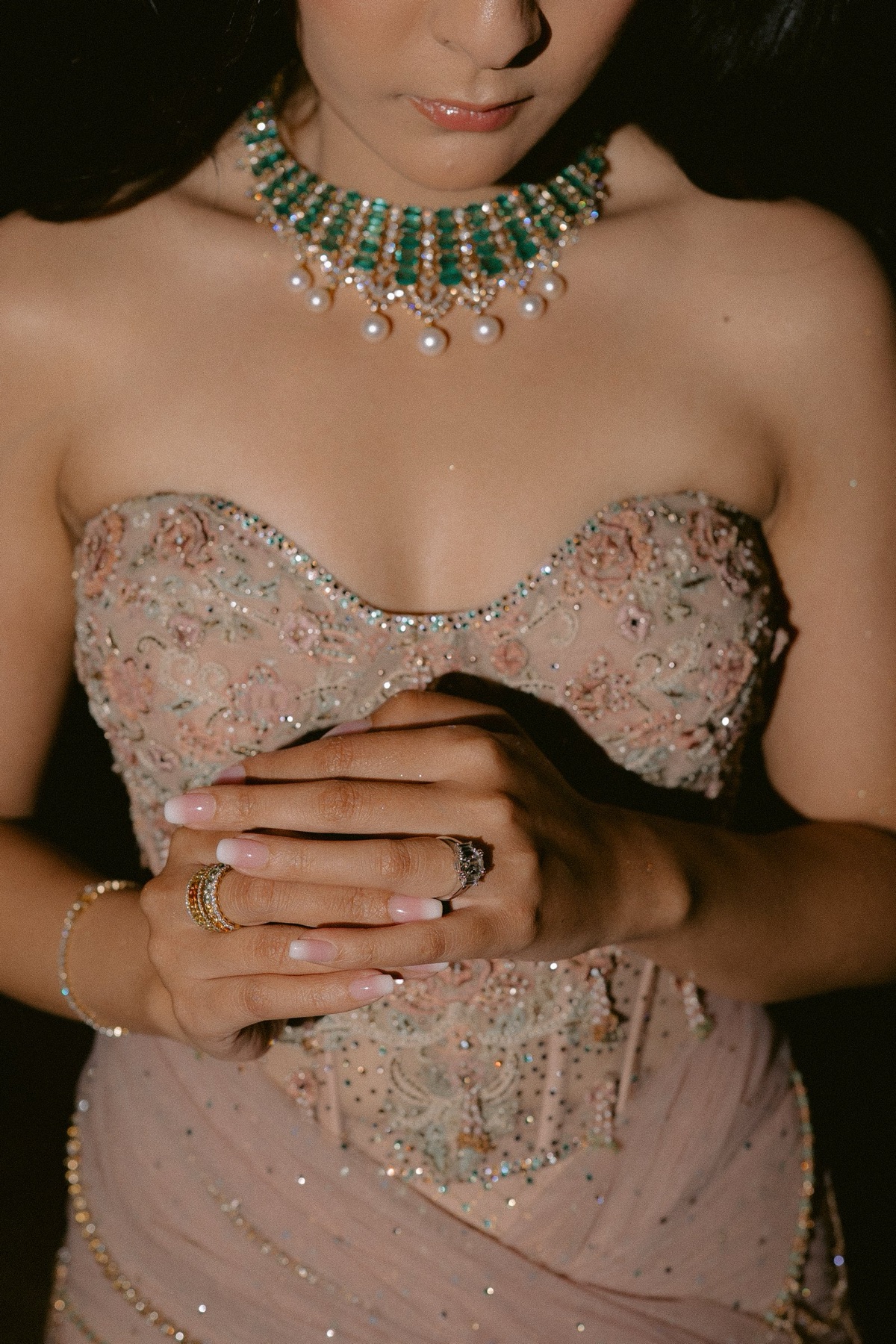 Shaibyaa’s blush corset outfit with an emerald necklace